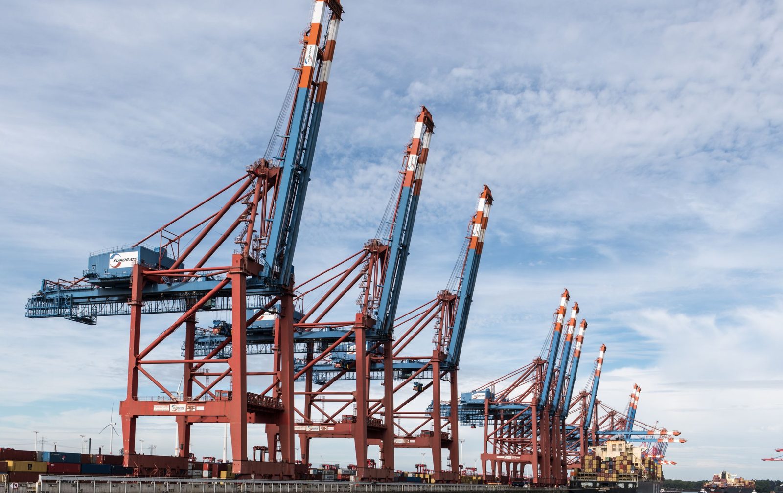 Container cranes at a European port with a ship alongside